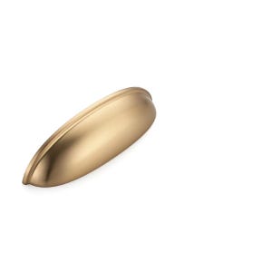 May include: A semi-circular cup pull handle with a smooth, matte gold finish. The hardware features a curved, ergonomic design with a recessed grip area and two mounting points on the flat base, showcasing a clean, solid metallic construction.
