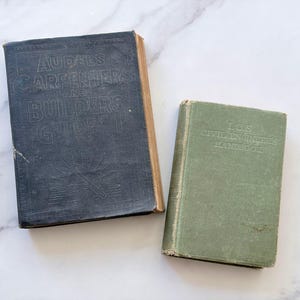 May include: Two vintage hardcover books. The larger black book is titled Audels Carpenters and Builders Guide 1 with an embossed graphic. The smaller green book is titled I.C.S. Civil Engineers Handbook with embossed lettering on the cover.