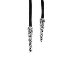 May include: Two black shoelaces with silver shell-shaped tips. The laces are hanging down and the tips are facing down.
