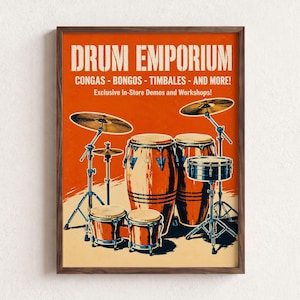 May include: A framed poster with an orange background featuring a drum set illustration. The text reads DRUM EMPORIUM, CONGAS - BONGOS - TIMBALES - AND MORE!, and Exclusive In-Store Demos and Workshops!. The drums are brown with metallic hardware.