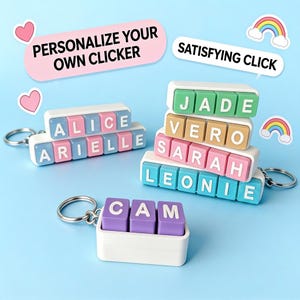 May include: Three rectangular white plastic clicker keychains with metal rings. One keychain displays the names ALICE and ARIELLE in blue and pink blocks. Another stack shows JADE, VERO, SARAH, and LEONIE. A third keychain displays CAM in purple blocks.