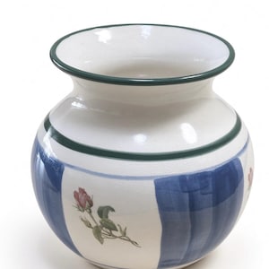 May include: A ceramic vase with a rounded body and a wide opening. The surface is off-white with a crackle glaze finish. It features vertical blue stripes and a dark green rim. A small pink rose bud with green leaves is painted on the side.