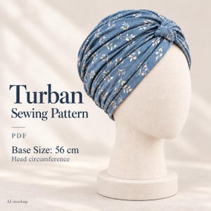 May include: A blue turban with a white leaf pattern on a mannequin head. Text reads: Turban Sewing Pattern, PDF, Base Size: 56 cm Head circumference, AI mockup. The fabric features gathered folds and a central knot detail at the front.