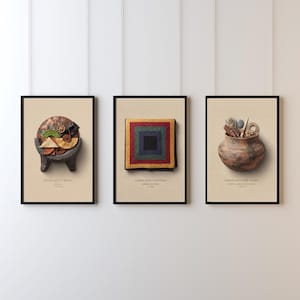May include: Three framed vertical art prints on a light wall. The left print shows a molcajete bowl with ingredients. The center print displays a square Amish quilt pattern with red, green, and blue borders. The right print features a coiled pottery vessel.
