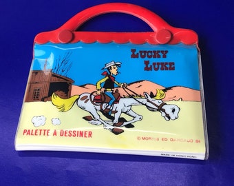 Vintage Lucky Luke Vinyl Mini Notebook with Drawing Palette. 1984 Lucky Luke Collectible by Morris Ed Dargaud. Mini bag Made in Hong Kong