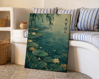 May include: A rectangular canvas print featuring a dark teal pond with green lily pads and white lotus flowers under falling rain. The artwork includes vertical Japanese text and a small red seal stamp in the upper right corner of the composition.
