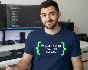 May include: A navy blue short-sleeved t-shirt featuring bright green curly brackets enclosing the white text: MY CODE WORKS. I HAVE NO IDEA WHY. The shirt has a crew neckline and is made of a solid-colored fabric with a screen-printed graphic design.