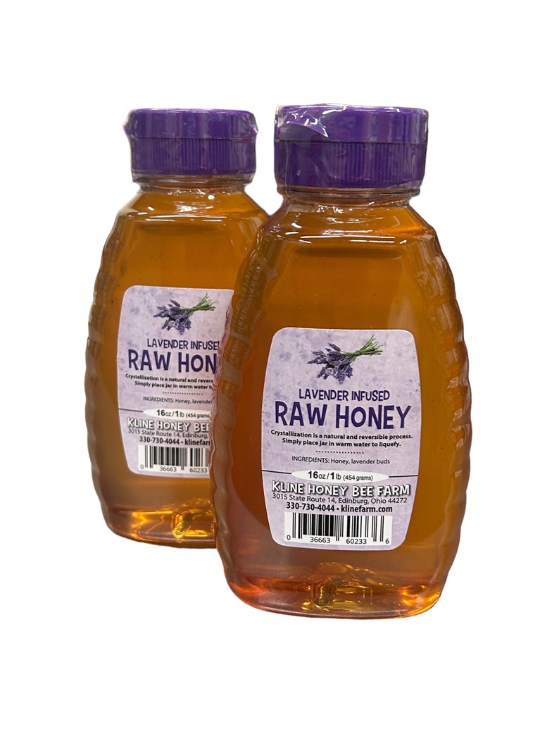 May include: Two 16 ounce bottles of raw honey infused with lavender. The bottles have purple lids and labels that say "Lavender Infused Raw Honey". The labels also include the ingredients, honey and lavender buds, and the company name, Kline Honey Bee Farm.