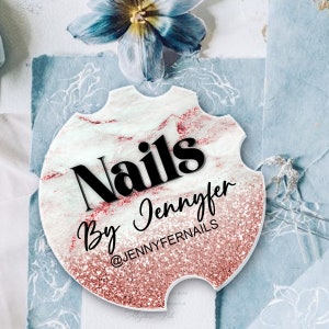 May include: A round, white and pink marble-patterned sticker with a black and white text overlay. The text reads "Nails By Jennifer @JENNYFERNAILS".