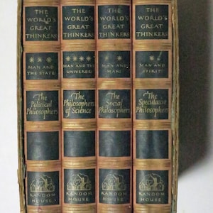 May include: A set of four brown hardback books with gold lettering. The books are titled "The World's Great Thinkers" and each book focuses on a different topic: "Man and the State", "Man and the Universe", "Man and Man", and "Man and Spirit". The books are published by Random House.