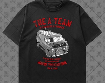 May include: A black short-sleeve t-shirt featuring a white line-art illustration of a van with an open hood. Red text above reads THE A-TEAM IF YOU HAVE A PROBLEM and red text below reads IF NO ONE ELSE CAN HELP AND YOU CAN FIND THEM MAYBE YOU CAN HIRE THE A-TEAM.
