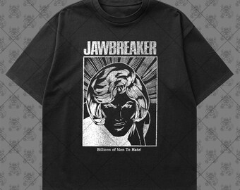 May include: A black short-sleeve t-shirt featuring a white graphic print of a person with wavy hair inside a rectangular frame. The text JAWBREAKER is printed above the image, and the text Billions of Men To Hate! is printed below.