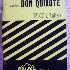 May include: A yellow and black Cliff's Notes study guide for Cervantes' Don Quixote. The cover features bold diagonal stripes, the title in black text, and the Cliff's Notes logo at the bottom with the address for Bethany Station, Lincoln, Nebraska.
