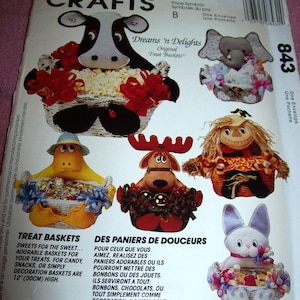 May include: A McCall's Crafts pattern for Dreams 'n Delights treat baskets. The pattern features designs for a cow, elephant, duck, reindeer, scarecrow, and bunny-shaped baskets. Baskets are 12 inches (30cm) high and designed for treats, candy, or decoration.