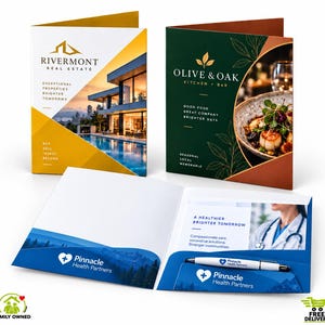May include: Three presentation folders featuring branding for Rivermont Real Estate, Olive & Oak Kitchen & Bar, and Pinnacle Health Partners. The folders display company logos, contact text, and imagery, with one folder open containing a branded pen.