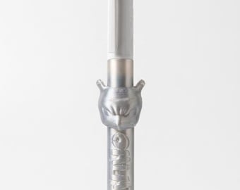 May include: A multi-color ballpoint pen featuring a white plastic top section with red, black, green, and blue ink selectors. The lower barrel is metallic silver with a sculpted Mewtwo character head and the embossed text MEWTWO vertically.