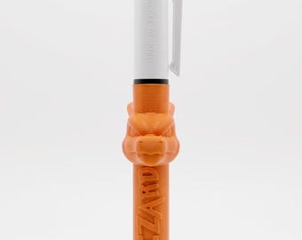 May include: A multi-color retractable ballpoint pen featuring a white upper barrel with blue and red ink selectors, a white pocket clip, and a custom orange lower barrel embossed with the text CHARIZARD and a sculpted dragon head.