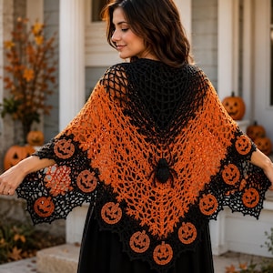 May include: A triangular crochet shawl featuring a black spider at the center and a web-like pattern. The shawl transitions from a black upper section to a vibrant orange middle, finished with a black border adorned with orange pumpkin motifs.