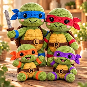 May include: Four crocheted turtle dolls with green bodies and yellow shells. The top two wear blue and red masks, one holding a gray sword. The bottom two wear orange and purple masks. Each has a brown belt with a letter L, R, M, or D.