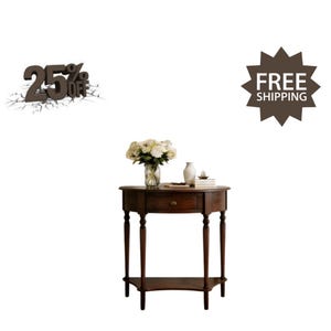 May include: A dark brown wooden half-moon console table with a single central drawer, four slender legs, and a lower shelf. A glass vase filled with white flowers and a small white ceramic vase sit on the tabletop surface.