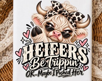 May include: A white rectangular surface featuring a graphic of a fluffy cow wearing sunglasses and a leopard print bow. The text reads HEIFERS Be Trippin' OK... Maybe I Pushed Her, surrounded by small pink hearts and decorative black line accents.