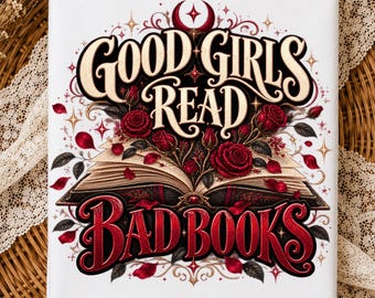 May include: A white rectangular fabric panel featuring a graphic illustration of an open book with deep red roses emerging from the pages. The text "GOOD GIRLS READ" appears in cream above the book, and "BAD BOOKS" in red below the book.