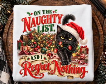 May include: A white sweatshirt featuring a black cat wearing a Santa hat, tangled in colorful Christmas lights. The text reads ON THE NAUGHTY LIST, AND I Regret Nothing, surrounded by holiday decorations, wrapped gifts, and pine branches.