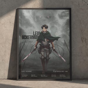 May include: A framed poster featuring Levi Ackerman from Attack on Titan, depicted in a dark green cloak and uniform with dual blades. The background shows a misty, grey battlefield with a giant titan silhouette. Text includes Levi Ackerman, Scout Regiment, and 57th Expedition 850.