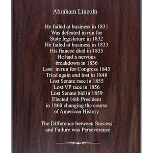 May include: A wood-grain background with a white text overlay. The text reads "Abraham Lincoln" and lists a series of events in his life, including his failures and eventual success as the 16th President of the United States. The text concludes with the phrase "The Difference between Success and Failure was Perseverance."