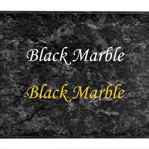 May include: A black marble texture background with the words "Black Marble" in white script and gold script. The image is framed with a black border and set against a white background.