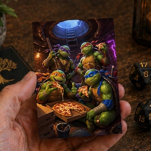 May include: A rectangular art print featuring the four Teenage Mutant Ninja Turtles in a sewer setting. The green characters are shown eating pizza from a cardboard box. The scene includes a manhole cover opening above and a dark, detailed background.