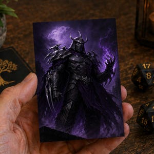 May include: A rectangular trading card featuring a dark, armored warrior with a spiked helmet and sharp clawed gauntlets. The character stands against a deep purple, misty background with glowing energy effects surrounding the hand and armor.