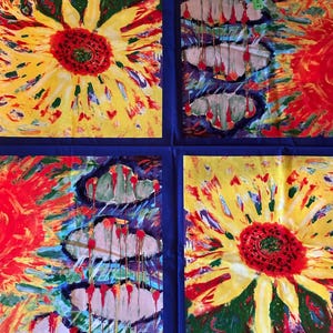 May include: Four-panel artwork featuring vibrant, abstract floral designs. Each panel showcases a sunflower with yellow petals and a red center, set against a blue border. The artwork uses bold brushstrokes and a mix of colors.