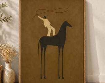 May include: A framed wall art print featuring a stylized illustration of a dark brown horse with long, thin legs. A figure in light beige clothing and a blue hat stands on the horse's back, holding a red lasso loop above their head.