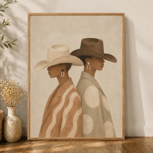 May include: A framed wall art print depicting two figures in profile wearing wide-brimmed cowboy hats. The figure on the left wears a tan hat and a wavy-patterned jacket, while the figure on the right wears a dark brown hat and a polka-dot jacket.