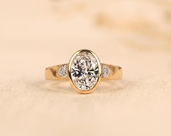 Oval Lab-Grown Diamond Bezel Ring, Two Side Stones, Gold Engagement Ring