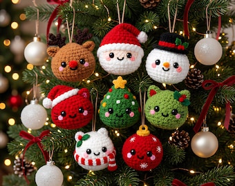 May include: A collection of crocheted Christmas ornaments hanging on a tree, including a brown reindeer, a Santa Claus, a snowman, a red cat, a green Christmas tree, a green cat, a white bear with a red scarf, and a red ball with white stars.