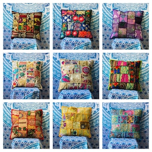 May include: A collection of nine square scatter cushions featuring patchwork designs made from various colourful fabrics. Each cushion displays a unique arrangement of embroidered patterns, floral motifs, and geometric shapes in diverse colour palettes.