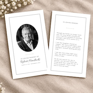May include: Two white memorial cards with black borders. The left card features an oval black and white portrait of a man, the text In Loving Memory of Robert Hendricks, and dates. The right card contains the poem In Loving Memory.