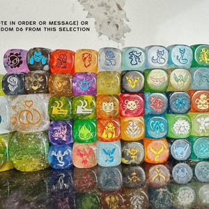 May include: A collection of multi-colored six-sided dice featuring various engraved creature and symbol designs. The text at the top reads: PICK 5 (NOTE IN ORDER OR MESSAGE) OR GET 5 RANDOM D6 FROM THIS SELECTION. The dice are translucent and glittery.