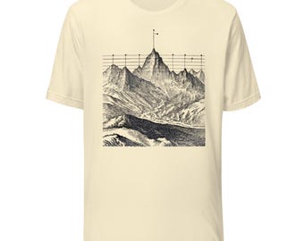 May include: A cream-colored short-sleeve t-shirt featuring a black and white graphic print of a mountain range. The illustration includes a series of horizontal lines and vertical markers extending from the peaks, resembling a technical chart.