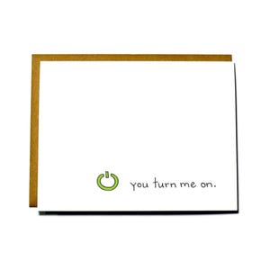 May include: A white card with a green power button icon and the text "you turn me on."