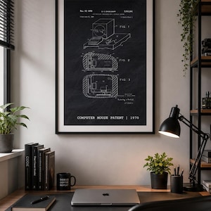 May include: A framed black and white patent print titled COMPUTER MOUSE PATENT | 1970, featuring technical line drawings of a computer mouse and keyboard system on a dark background, displayed in a thin black frame on a wall.