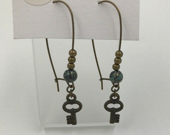 Antique brass earrings with key