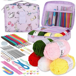 May include: A light purple travel case with a whimsical print containing various crochet hooks, knitting needles, and yarn skeins in green, pink, red, white, and yellow. Includes a pink ruler, stitch markers, and assorted metal and colorful tools.