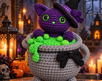 May include: A purple crocheted cat wearing a black witch hat with a purple band, sitting inside a grey crocheted cauldron. The cauldron is filled with bright green crocheted bubbles and features a black bow on the front and small feet.