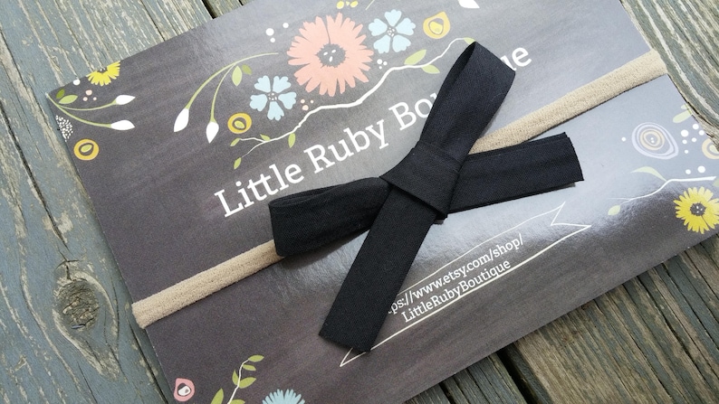 Black bow on nude nylon