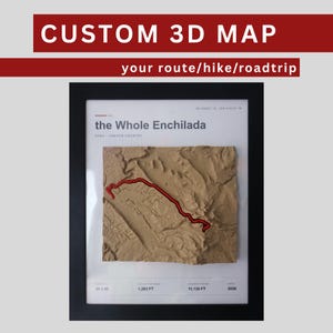 May include: A framed custom 3D map titled The Whole Enchilada, Utah Canyon Country. The tan relief map features a red line indicating a route. Text includes CUSTOM 3D MAP, your route/hike/roadtrip, 26.5 Mi, 1,283 FT, 11,126 FT, and 2026.