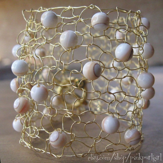 Items similar to Knitted Gold Wire Cuff with Natural Shell Beads on Etsy