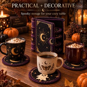 May include: A black and purple crocheted coaster set shaped like a book, featuring gold celestial embroidery of moons and stars. The set includes circular coasters with various motifs like a ghost, a moth, and moons, displayed with three mugs.